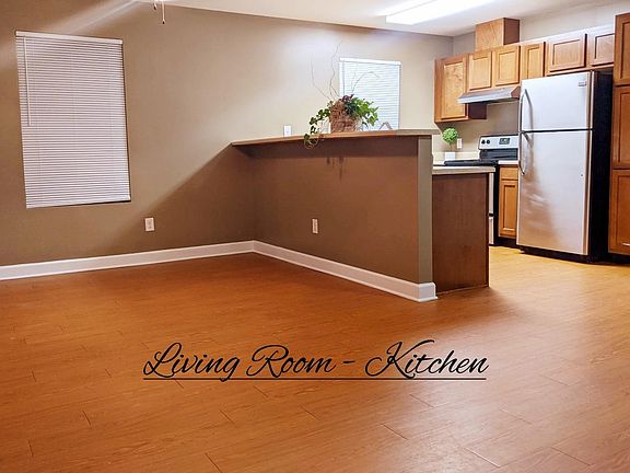 Living Room - The available unit, interior walls are gray.
