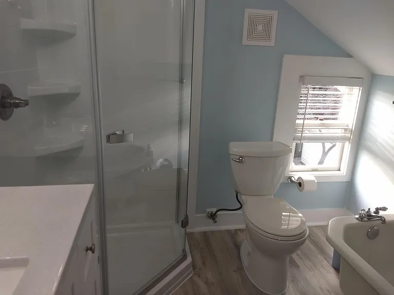 Second floor full bathroom with new shower and vintage tub.