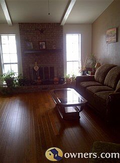 Living room w/cathedral ceilings and fireplace