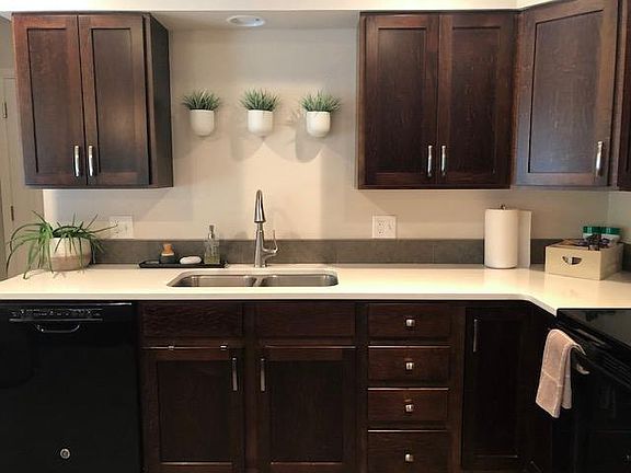 Dishwasher, double stainless sink with pull down sprayer, smooth top stove, double door refrigerator with ice maker