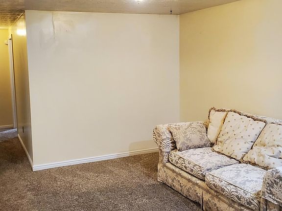 Living area. Super nice couch is stuck downstairs.