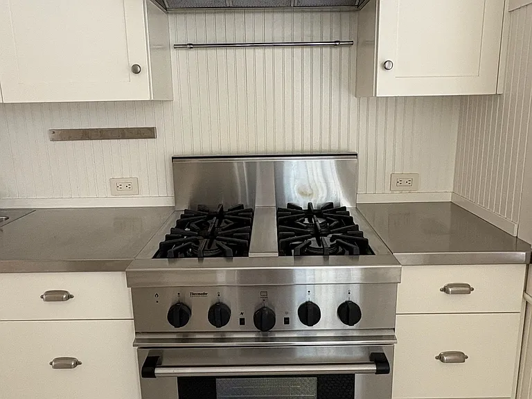 Kitchen with Thermador gas range and custom cabinetry