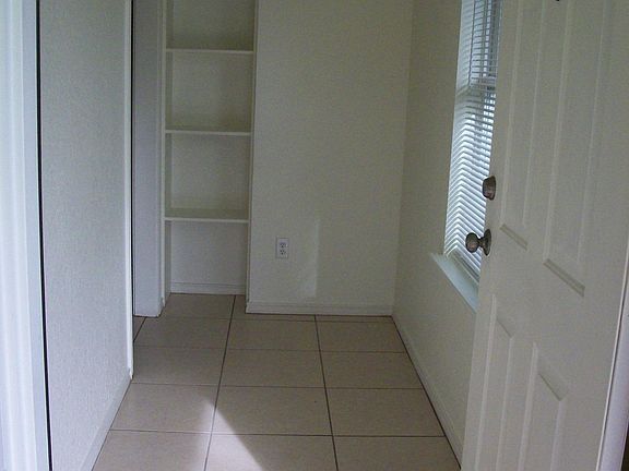 Entry with 
 bookcase