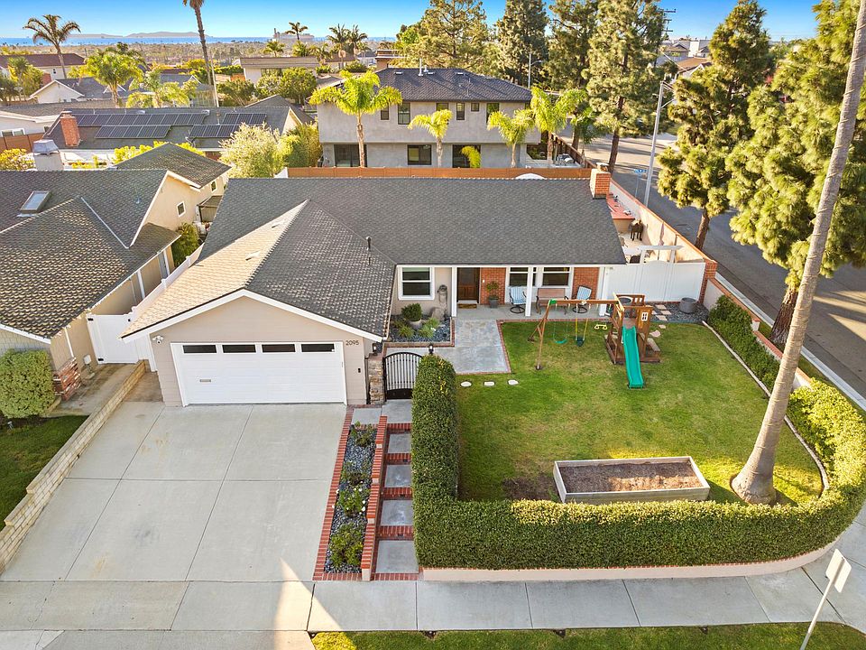 Spacious corner lot surrounded by a privacy hedge