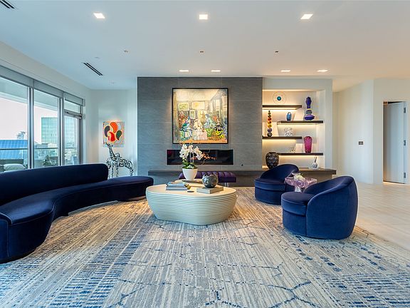Living Room access to large protected Balcony.