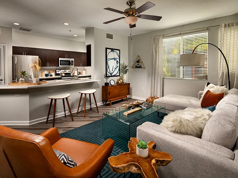 One Bedroom Apartments in La Mesa CA - The District - Spacious Living Room and Kitchen with Wood-Style Flooring
