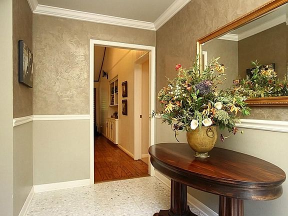 Upon entering the foyer, the family room is straight back, and living room to the left