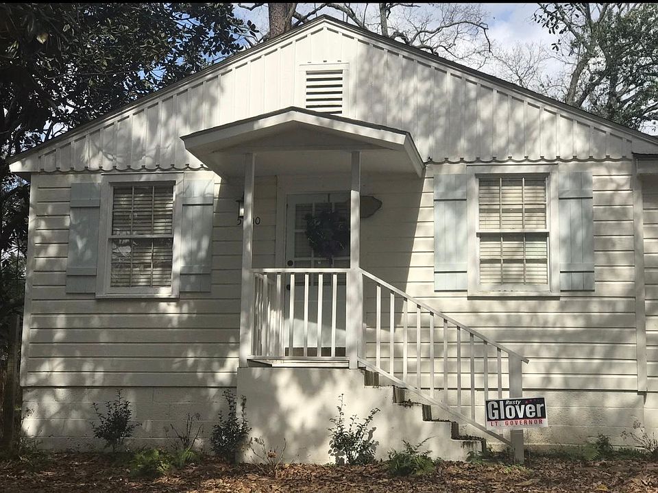 Freshly painted exterior with new wooden shutters