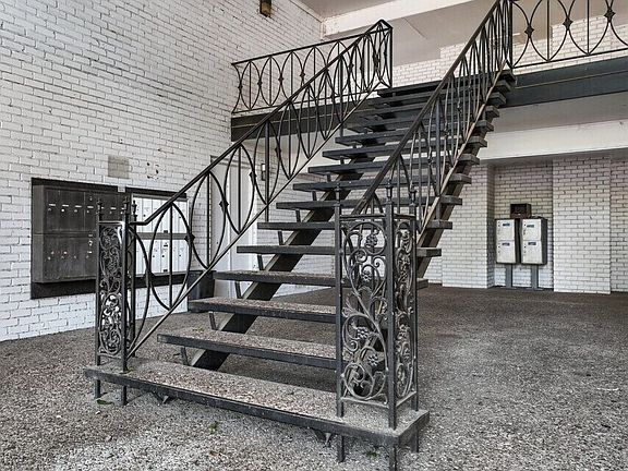 Well-maintained stair access leading to upper-level apartment homes with private entries.