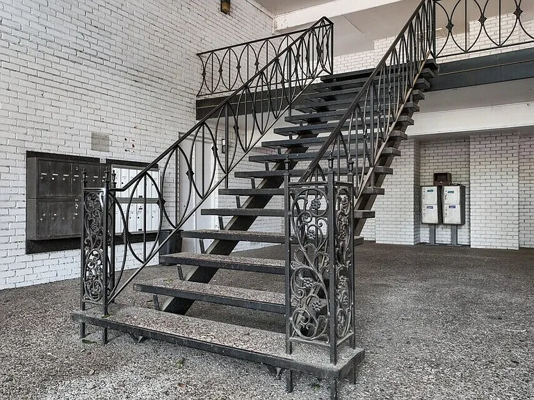 Well-maintained stair access leading to upper-level apartment homes with private entries.