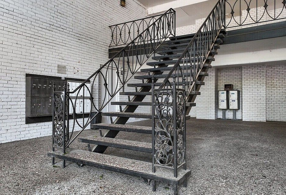 Well-maintained stair access leading to upper-level apartment homes with private entries.