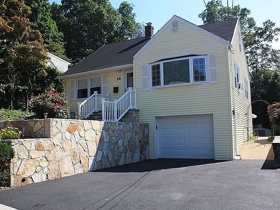 double driveway and stone retaining wall
