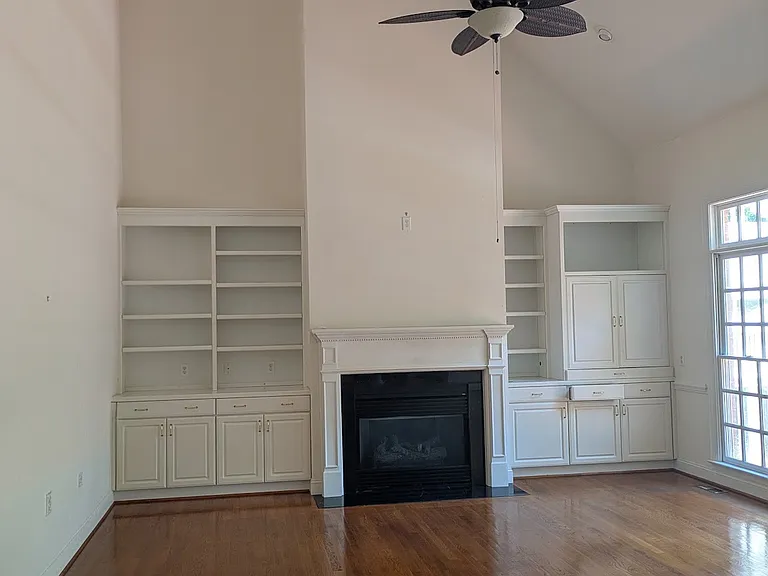 Family room/living room with vaulted ceilings and floor outlets.