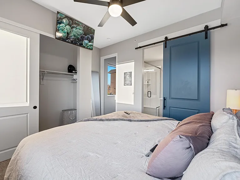 Aaah! Relax after a long day in this master suite with remote control fan, blinds, lighting, and smart TV perfectly positioned when you lay down on the customizable King Sleep Number bed. The closet has ample space and hangers to unpack clothing.