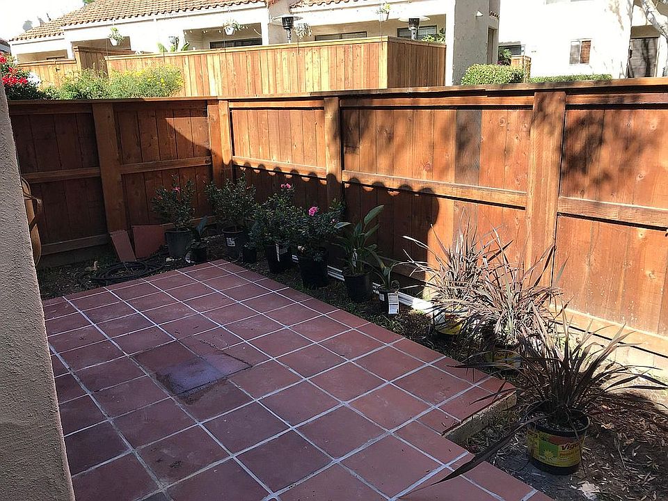 Tile Patio with Ample Room for Dining Table & Chairs (Ladscape Planting Just Underway When Picture Was Taken)