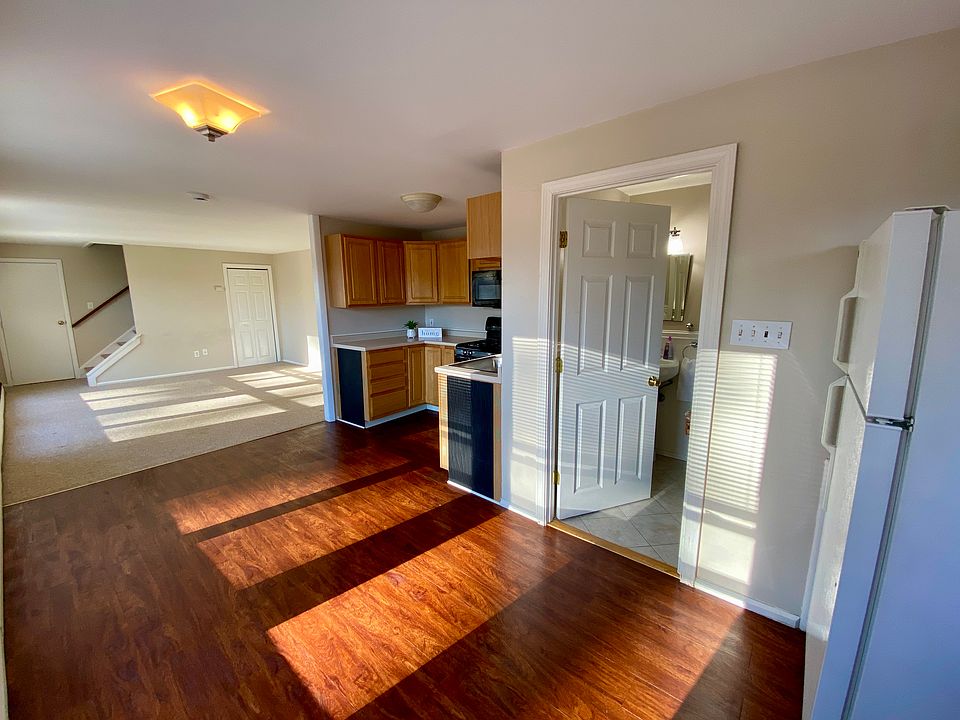 Bathroom is to the right where you see open door.