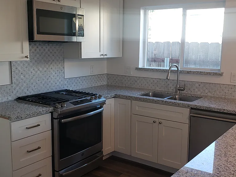 Close-up of GE appliances and Thermador dishwasher.