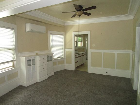 Dining Room. Split heating and air unit on wall. Ceiling fans in all rooms except kitchen.