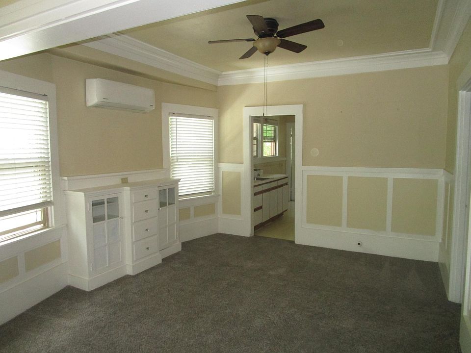 Dining Room. Split heating and air unit on wall. Ceiling fans in all rooms except kitchen.