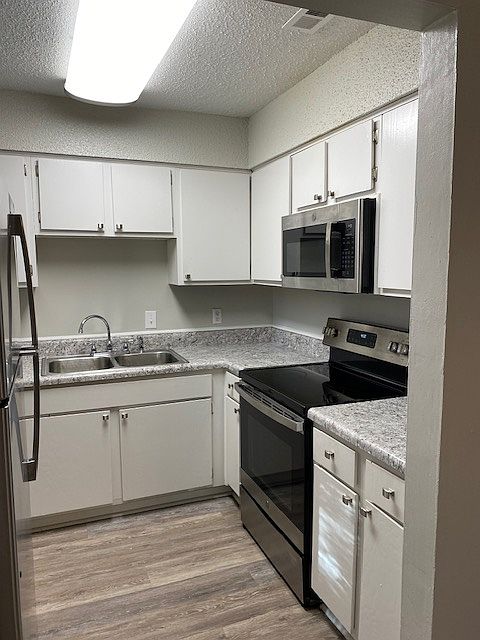 All kitchens have stainless steel appliances, oven, dishwasher, refrigerator, double sink, microwave and all have a window!