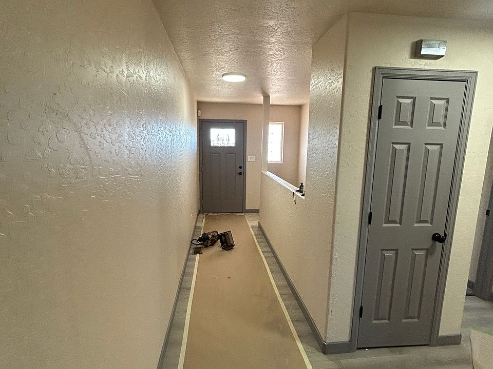 Main entry with storage closet. Tile and Wood floors.