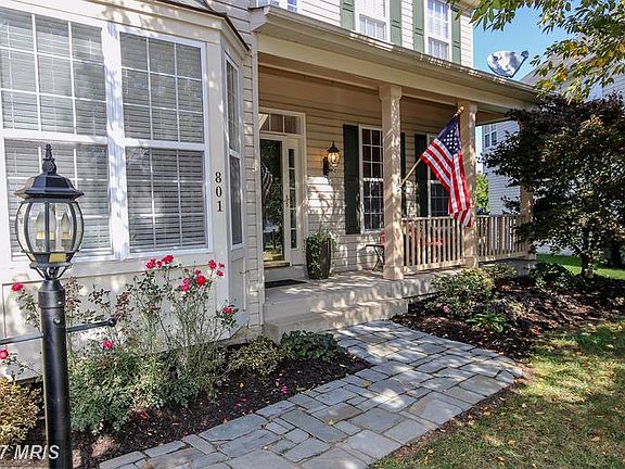 Handsome stone walkway leading to cozy front porch