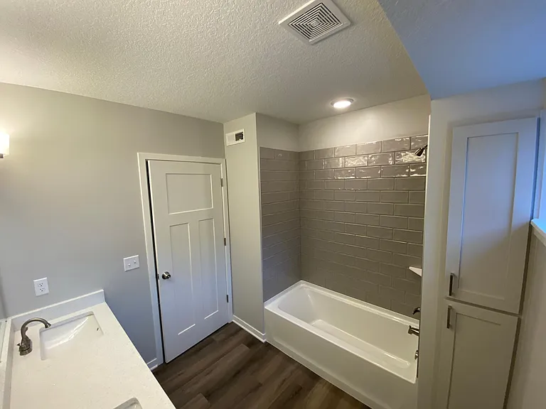Tile shower surrounds and quarts vanity tops