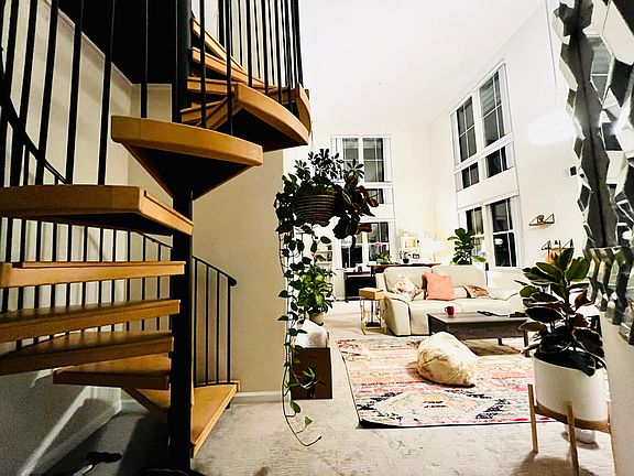 Living room and staircase leading to loft