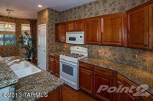CHERRY CABINETRY & GRANITE COUNTER TOPS