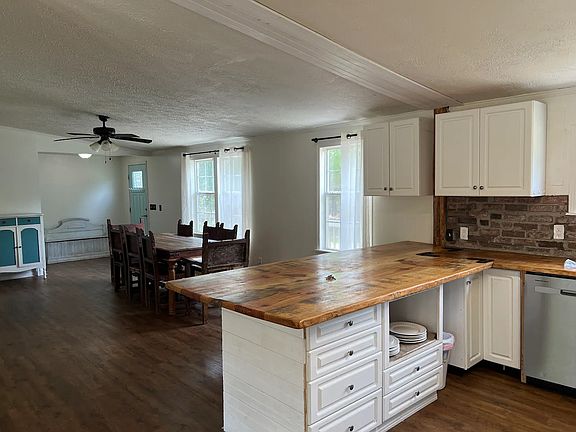 View of front door and dining room from kitchen
