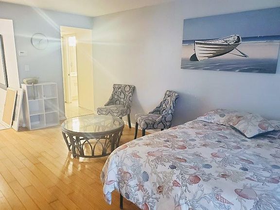 doorways to bathroom/closet area and to full kitchen and front doorway