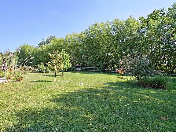 Enjoy The Scenery and Privacy Of The Wooded Backyard