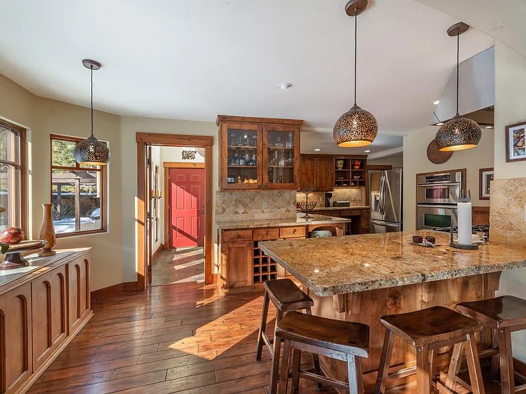 The large counter is perfect for prepping meals or laying out a nice spread of appetizers while others can be coming into the second mudroom from playing outdoors