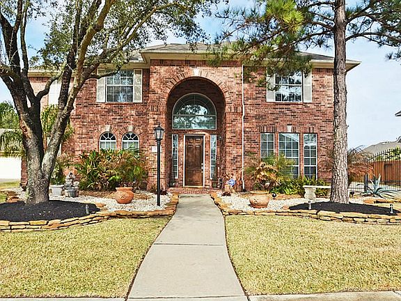 Detached garage with remote controlled gate.