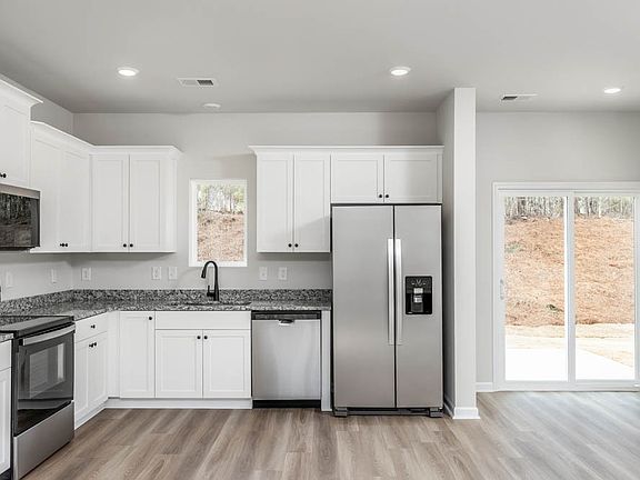 The kitchen has spacious countertops to make cooking easy.