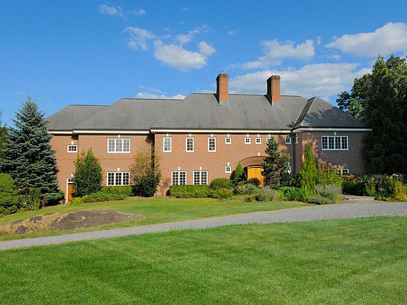 Custom Built Georgian Colonial in the literal heart of Mid Country Greenwich.