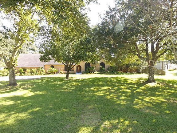 Serene country setting with mature trees throughout the property.