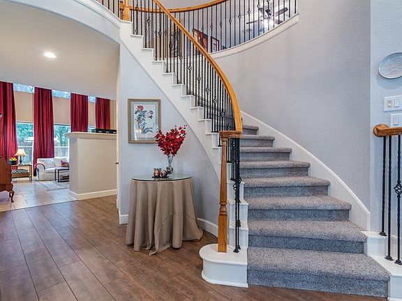 Upon entry, a classic winding wrought iron staircase steals the show!