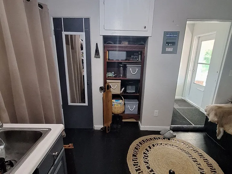 View from side to side toward entry -Previous resident's furnished view - unit is rented unfurnisd