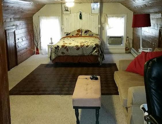 Unit 5 with furniture. Most people use this room as the living room but some use it as the bedroom.