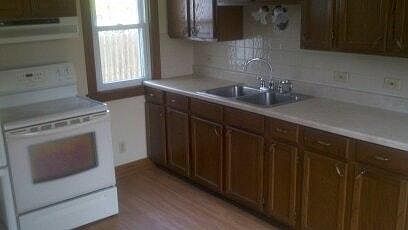 Kitchen w/ stove & fridge