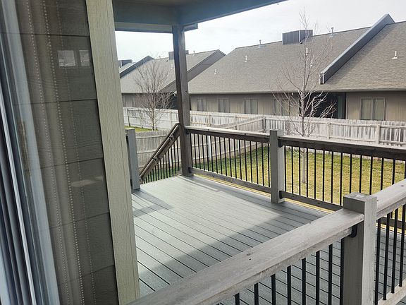 large covered deck and fenced back yard