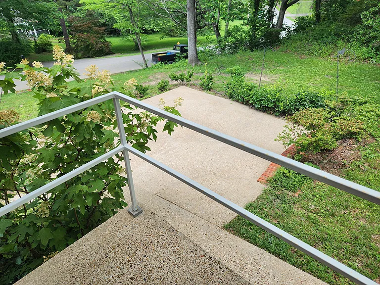 View from kitchen stoop to patio and quiet street