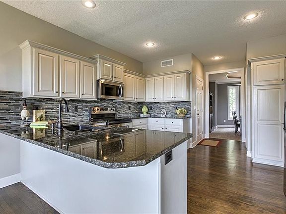 Beautiful light cabinets with granite countertops, stainless appliances.