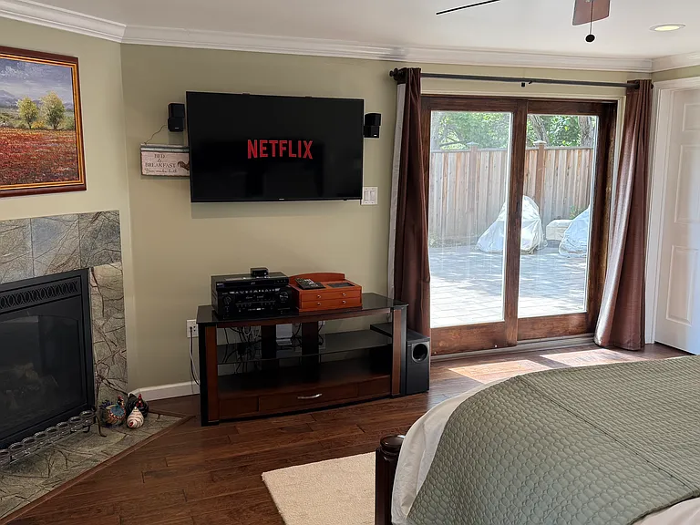 Smart TV and gas fireplace in the primary bedroom