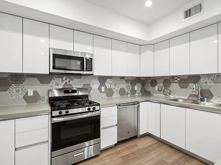 Kitchen with Energy-Efficient Stove and Microwave Oven