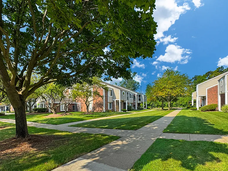 Private-Entry apartment buildings in Southfield with a walkway and sidewalk.