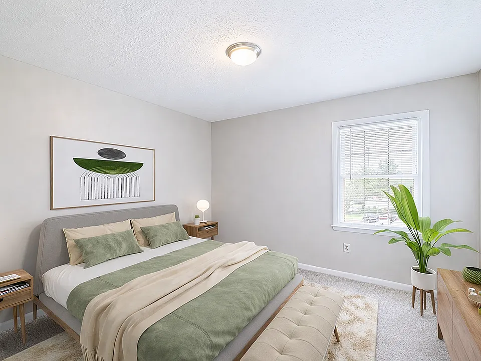 Serene neutral bedroom with sunlight