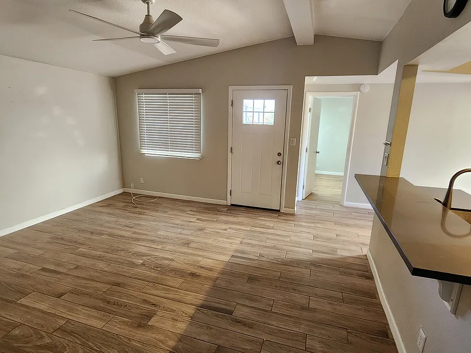 Entry and family room and door leading to bedroom #1 (or office).