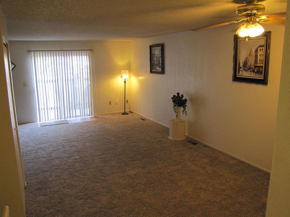 Main level living room/Dining with access to the Patio.